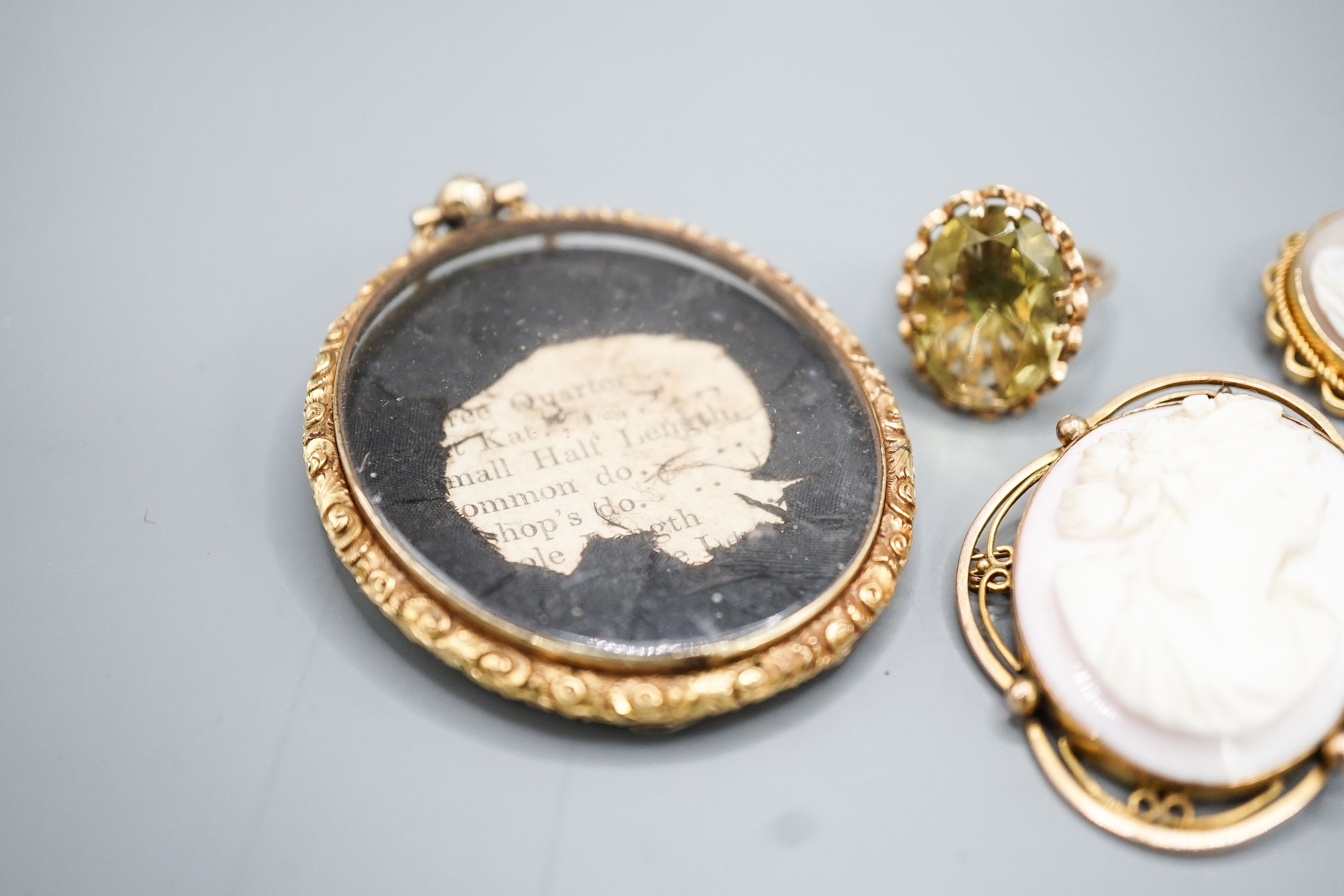 Two modern 9ct gold and gem set rings, a 9ct and gem set pendant, two 9ct mounted cameo shell brooches, gross weight 36.5 grams and a Victorian oval pendant frame, 55mm.